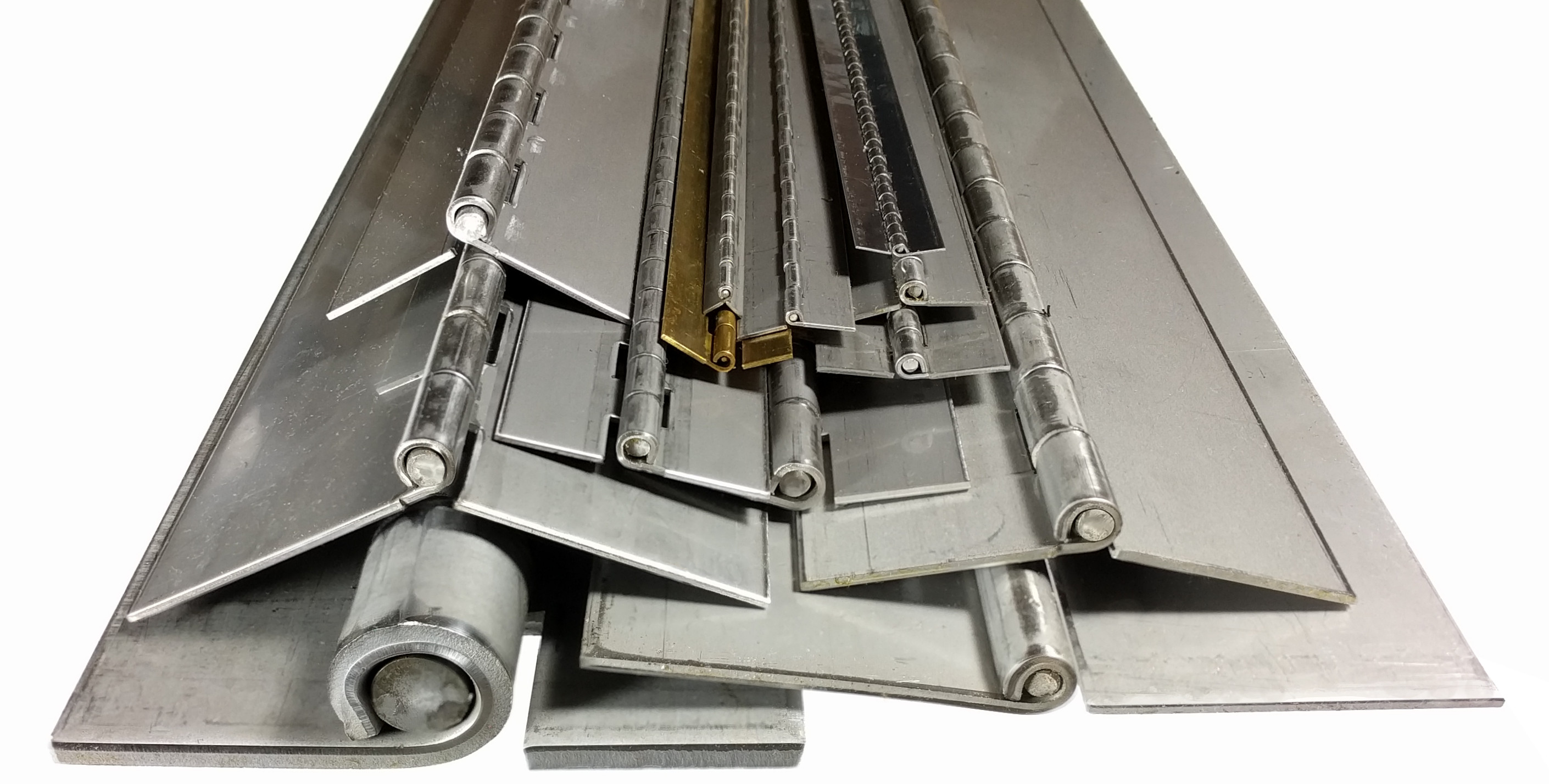 A pile of continuous hinges of varying sizes and metals